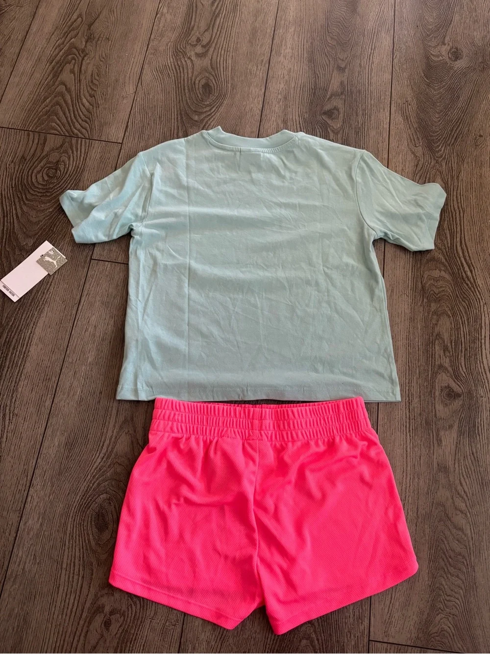 Puma Bright Pink Athletic Shorts with White Tag Detail